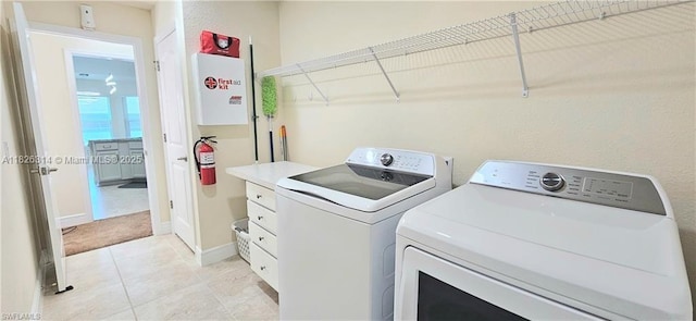 1948 Redmont Ave, Lehigh Acres, FL 33972 - laundry area with separate washer and dryer and light tile patterned floors
