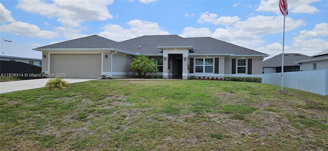 1948 Redmont Ave, Lehigh Acres, FL 33972 - view of front of house featuring driveway, an attached garage, and stucco siding