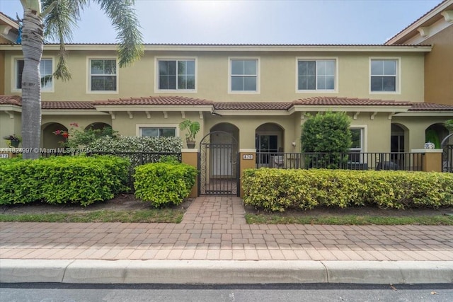 370 Lake Monterey Cir, Boynton Beach, FL 33426 - view of front of home with a gate and stucco siding
