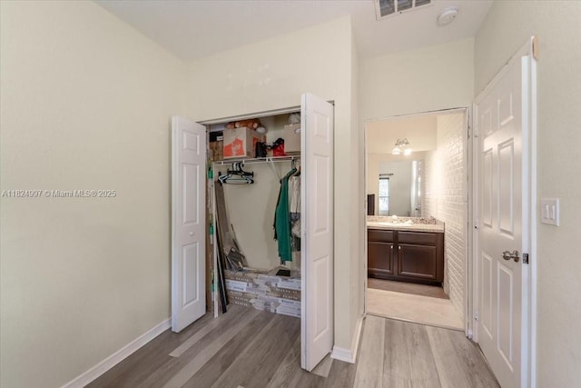 370 Lake Monterey Cir, Boynton Beach, FL 33426 - unfurnished bedroom with light wood-style flooring and a closet