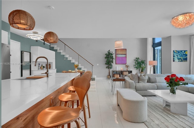 1111 SW 1st Ave Unit 721-N, Miami, FL 33130 - living room featuring stairway and light tile patterned floors