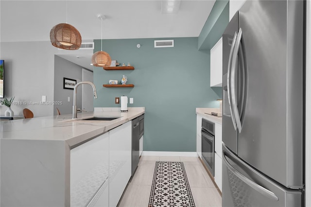 1111 SW 1st Ave Unit 721-N, Miami, FL 33130 - kitchen with appliances with stainless steel finishes, white cabinets, modern cabinets, a peninsula, and light tile patterned floors