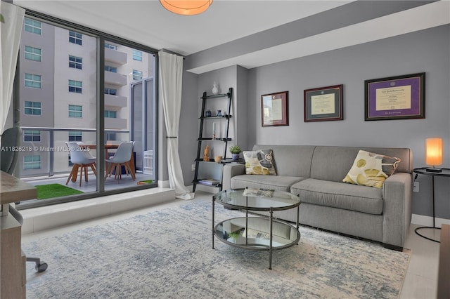 1111 SW 1st Ave Unit 721-N, Miami, FL 33130 - tiled living room featuring a wall of windows and baseboards
