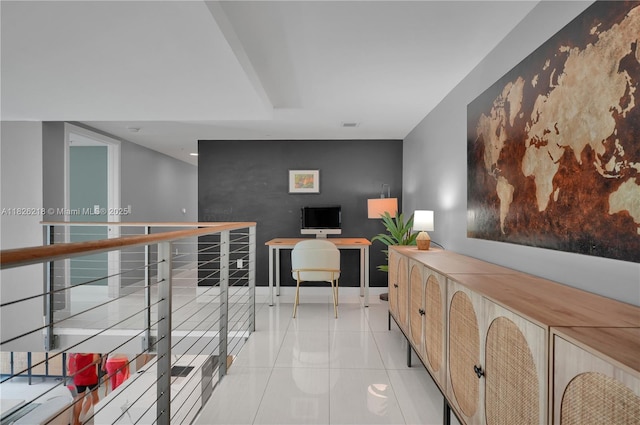 1111 SW 1st Ave Unit 721-N, Miami, FL 33130 - hall with light tile patterned floors, a desk, and an accent wall