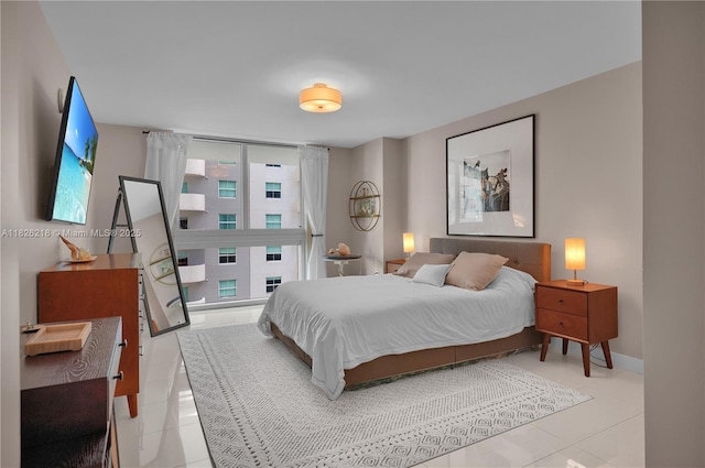 1111 SW 1st Ave Unit 721-N, Miami, FL 33130 - bedroom featuring light tile patterned floors and baseboards