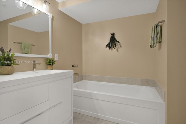 1111 SW 1st Ave Unit 721-N, Miami, FL 33130 - bathroom featuring vanity, a garden tub, and tile patterned floors