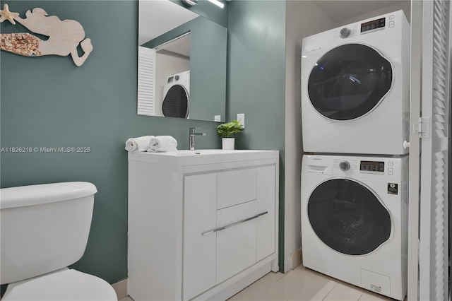 1111 SW 1st Ave Unit 721-N, Miami, FL 33130 - laundry area featuring stacked washing machine and dryer and light tile patterned floors