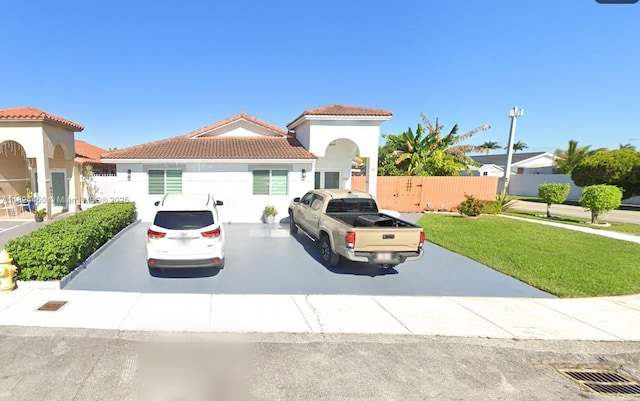 8905 NW 112th St, Hialeah Gardens, FL 33018 - mediterranean / spanish-style home with a tiled roof and stucco siding