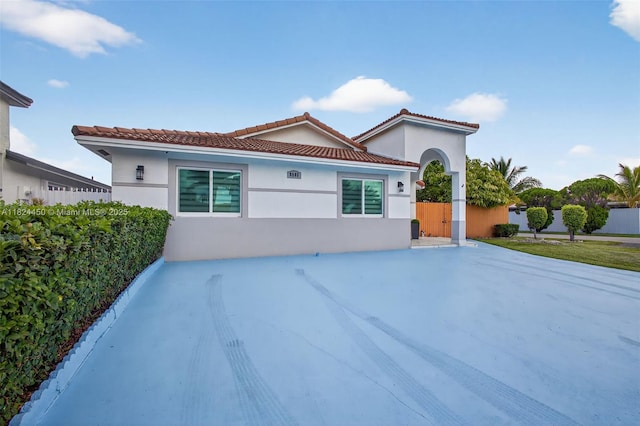 8905 NW 112th St, Hialeah Gardens, FL 33018 - mediterranean / spanish-style house with stucco siding and a tiled roof