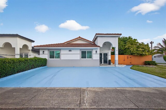8905 NW 112th St, Hialeah Gardens, FL 33018 - mediterranean / spanish-style house featuring stucco siding and a tiled roof