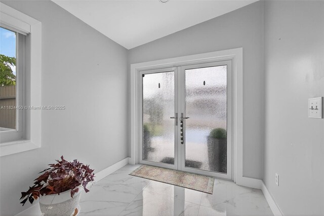 8905 NW 112th St, Hialeah Gardens, FL 33018 - doorway to outside featuring french doors, marble finish floors, and vaulted ceiling