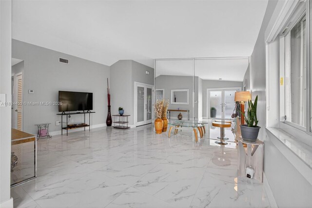 8905 NW 112th St, Hialeah Gardens, FL 33018 - living area featuring lofted ceiling and marble finish floors