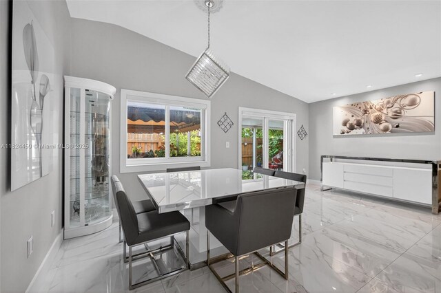 8905 NW 112th St, Hialeah Gardens, FL 33018 - dining area with lofted ceiling, light marble finish flooring, and recessed lighting