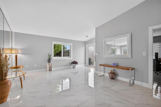 8905 NW 112th St, Hialeah Gardens, FL 33018 - unfurnished living room with marble finish floors and vaulted ceiling