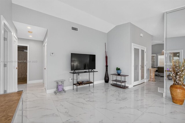 8905 NW 112th St, Hialeah Gardens, FL 33018 - living area featuring marble tiled floors, french doors, and recessed lighting