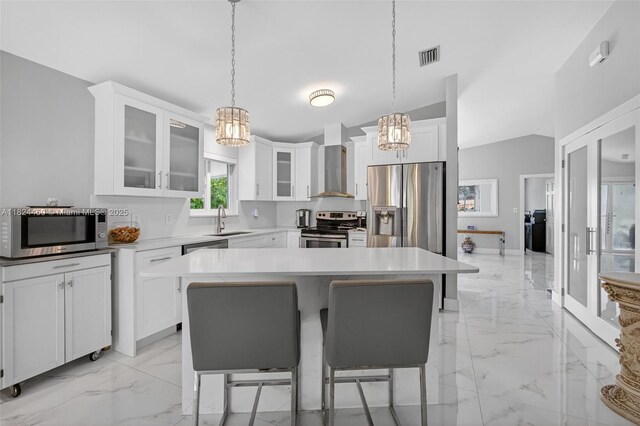 8905 NW 112th St, Hialeah Gardens, FL 33018 - kitchen with stainless steel appliances, a chandelier, light marble finish flooring, glass insert cabinets, and white cabinetry