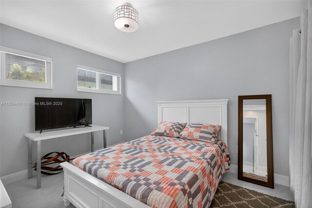 8905 NW 112th St, Hialeah Gardens, FL 33018 - bedroom featuring baseboards