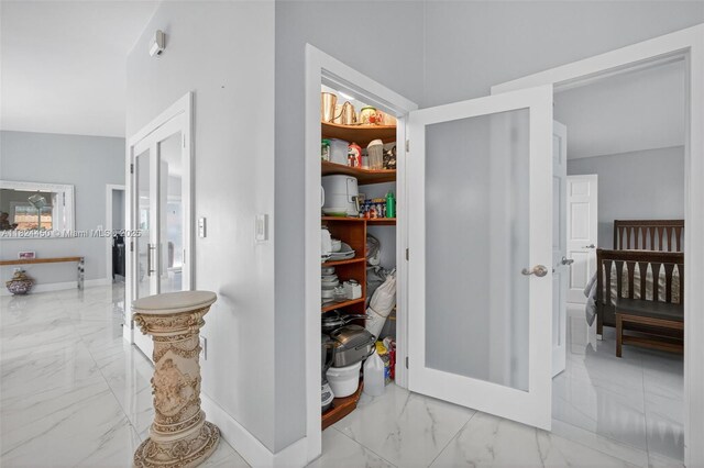 8905 NW 112th St, Hialeah Gardens, FL 33018 - corridor featuring marble finish flooring and baseboards