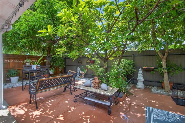 8905 NW 112th St, Hialeah Gardens, FL 33018 - fenced backyard with outdoor dining area and a patio area