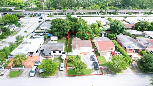 217 E 20th St, Hialeah, FL 33010 - aerial perspective of suburban area with property parcel outlined and a tree filled landscape