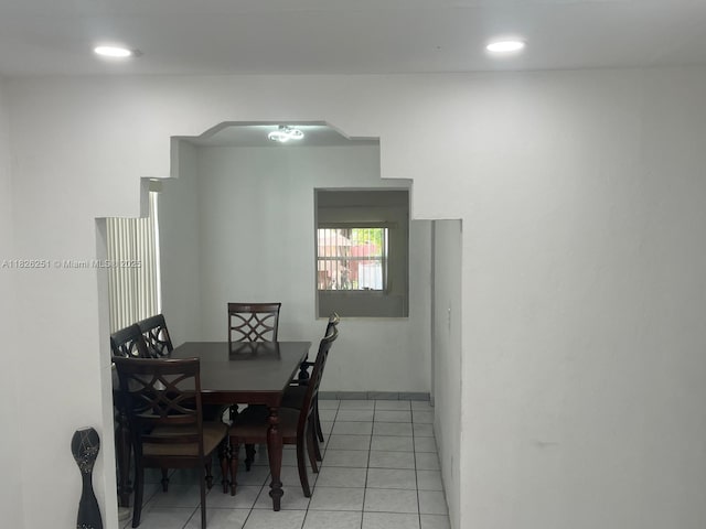 217 E 20th St, Hialeah, FL 33010 - dining space with arched walkways, light tile patterned floors, and recessed lighting