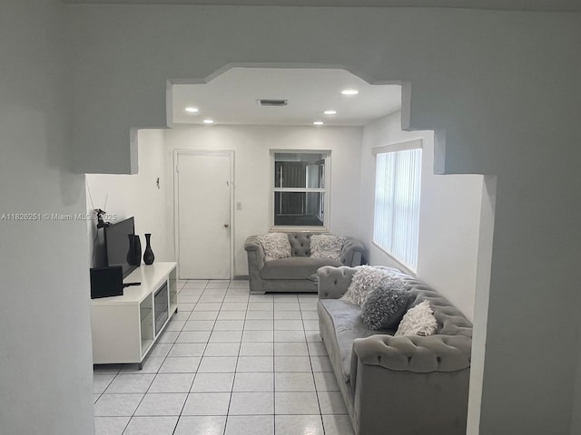 217 E 20th St, Hialeah, FL 33010 - living area with light tile patterned floors and recessed lighting