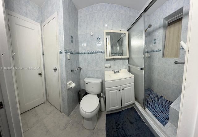 217 E 20th St, Hialeah, FL 33010 - bathroom with tile walls, vanity, a shower stall, and tile patterned flooring