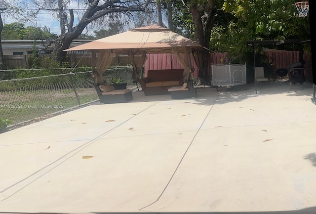 217 E 20th St, Hialeah, FL 33010 - fenced backyard with a gazebo, a patio area, and an outdoor hangout area