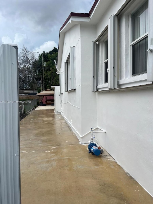 217 E 20th St, Hialeah, FL 33010 - view of side of home with stucco siding