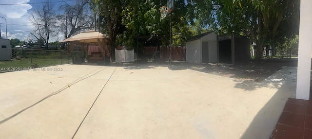 217 E 20th St, Hialeah, FL 33010 - view of property exterior featuring a gazebo, a patio, and an outbuilding