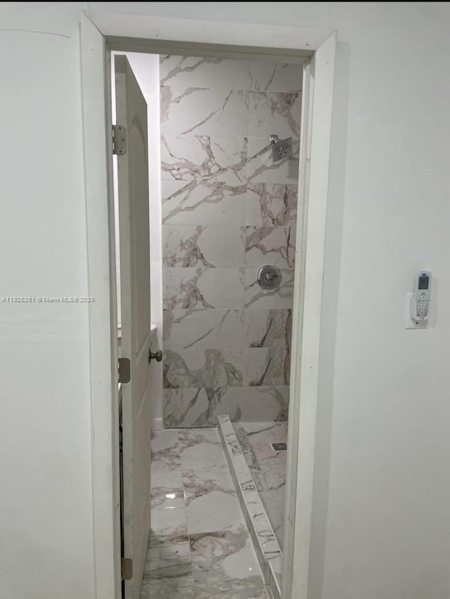 217 E 20th St, Hialeah, FL 33010 - bathroom with a stall shower and marble finish floors