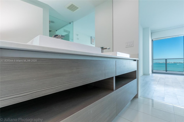460 NE 28th St Unit 1905, Miami, FL 33137 - bathroom with vanity, tile patterned floors, a water view, and a shower