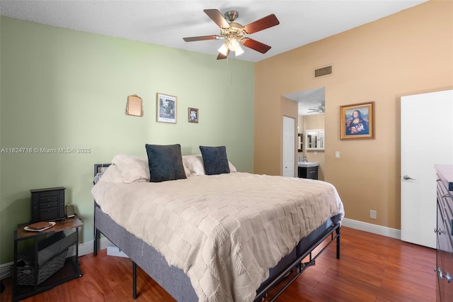 602 Lincoln Ct Unit 602, Deerfield Beach, FL 33442 - bedroom with wood finished floors, ensuite bath, and a ceiling fan