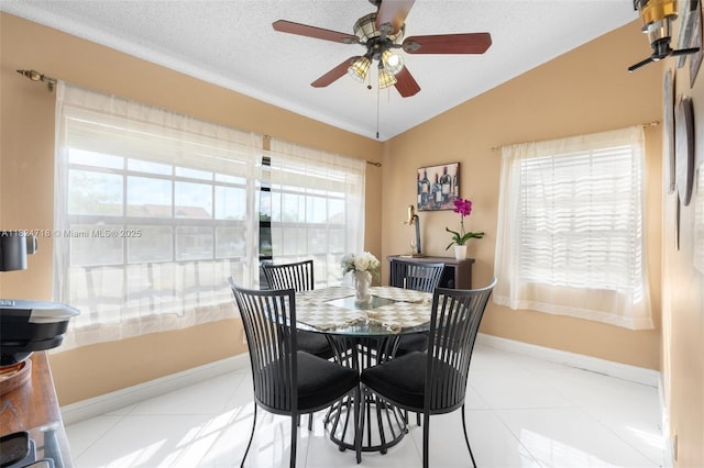 602 Lincoln Ct Unit 602, Deerfield Beach, FL 33442 - dining area with lofted ceiling, healthy amount of natural light, a ceiling fan, and light tile patterned floors