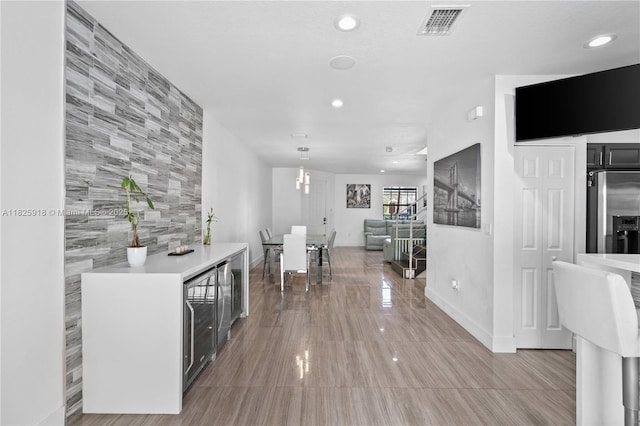 8880 W 35th Ct, Hialeah, FL 33018 - corridor with recessed lighting and wine cooler