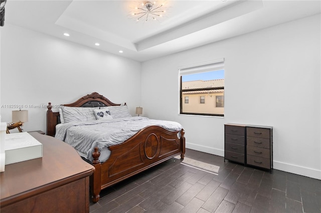 8880 W 35th Ct, Hialeah, FL 33018 - bedroom featuring recessed lighting, a tray ceiling, and dark wood-style flooring