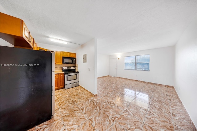 301 NW 177th St Unit 201, Miami Gardens, FL 33169 - kitchen featuring black appliances, light countertops, open floor plan, a textured ceiling, and decorative backsplash