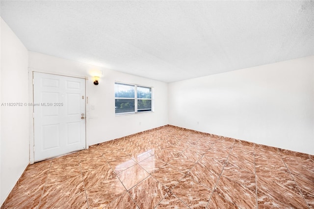 301 NW 177th St Unit 201, Miami Gardens, FL 33169 - unfurnished room with a textured ceiling