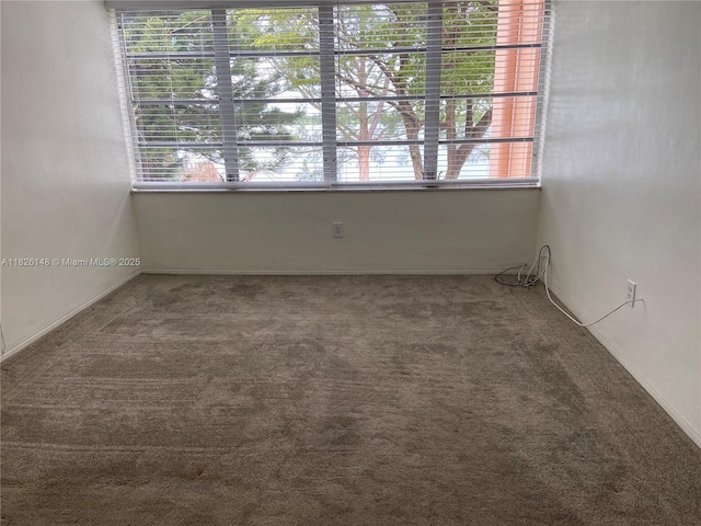 18707 NE 14th Ave Unit 638, Miami, FL 33179 - spare room with carpet