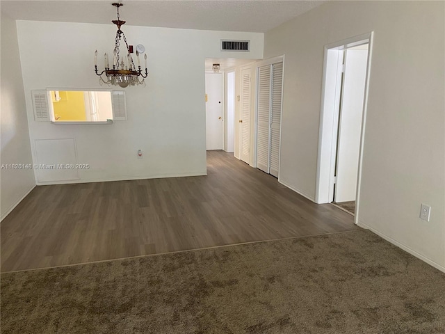 18707 NE 14th Ave Unit 638, Miami, FL 33179 - unfurnished room featuring a chandelier and wood finished floors