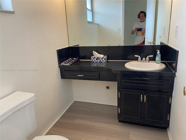 18707 NE 14th Ave Unit 638, Miami, FL 33179 - bathroom featuring wood finished floors and vanity