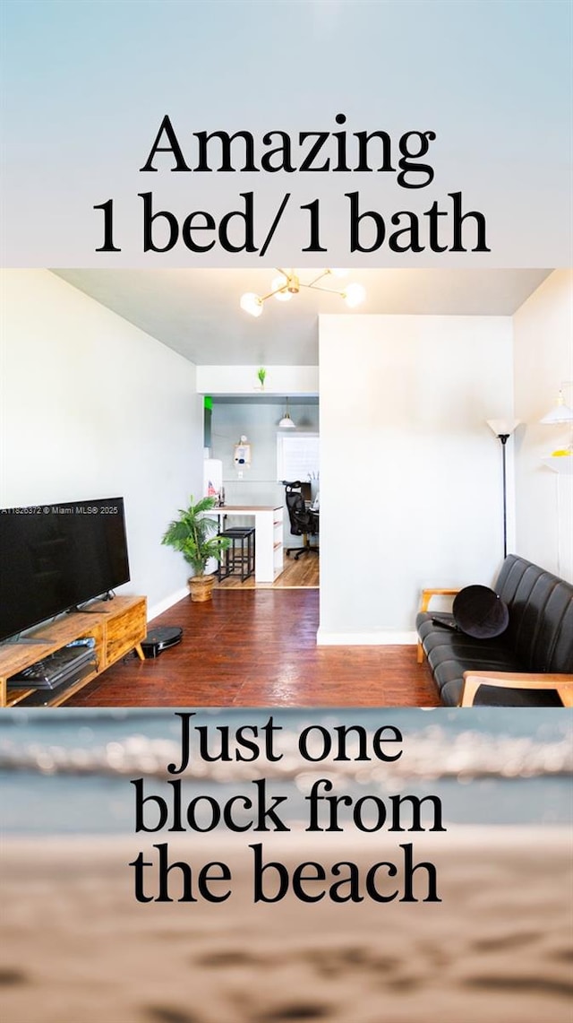 8420 Byron Ave Unit 6, Miami Beach, FL 33141 - living room with wood finished floors and baseboards