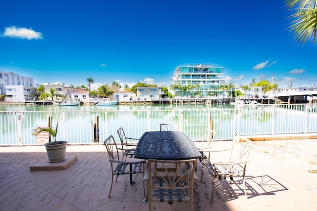8420 Byron Ave Unit 6, Miami Beach, FL 33141 - view of patio with a water view and outdoor dining area