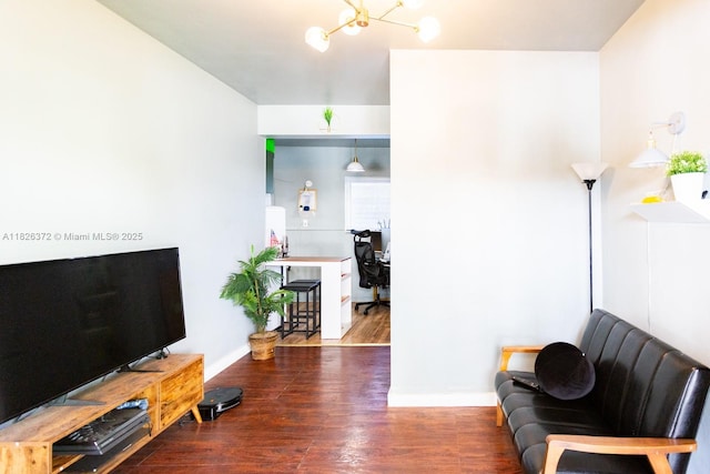 8420 Byron Ave Unit 6, Miami Beach, FL 33141 - living area with wood finished floors, an office area, and a chandelier