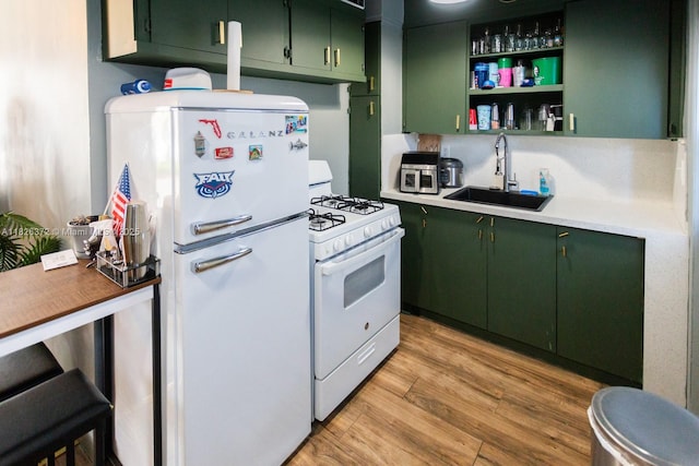 8420 Byron Ave Unit 6, Miami Beach, FL 33141 - kitchen with white appliances, green cabinets, light countertops, and light wood finished floors