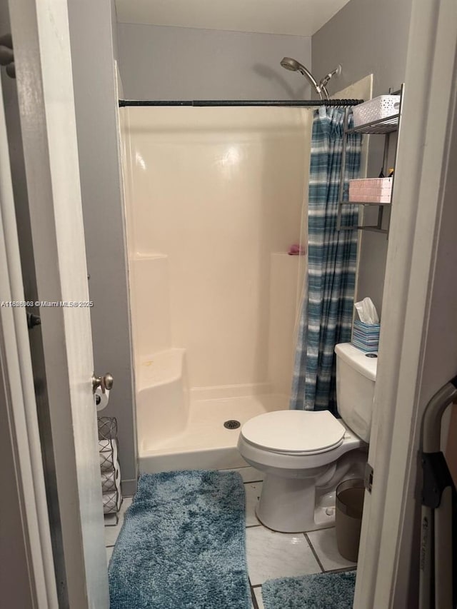 7301 SW 8th St, North Lauderdale, FL 33068 - bathroom with a stall shower and tile patterned floors
