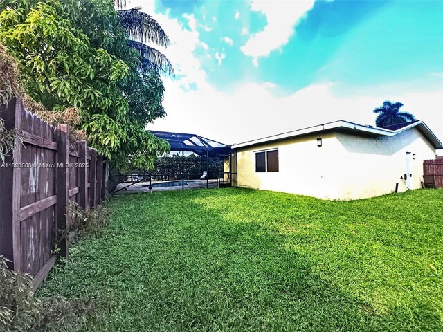 7301 SW 8th St, North Lauderdale, FL 33068 - fenced backyard featuring a lanai