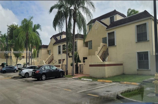 12922 SW 88th Ter Unit B-206, Miami, FL 33186 - view of building exterior with uncovered parking