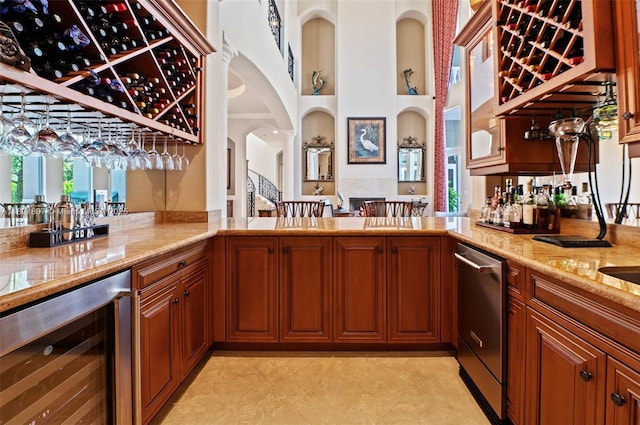12608 S Stonebrook Cir, Davie, FL 33330 - indoor wet bar with beverage cooler, dishwasher, and arched walkways