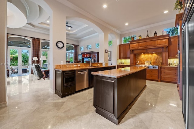 12608 S Stonebrook Cir, Davie, FL 33330 - kitchen featuring stainless steel appliances, french doors, tasteful backsplash, ornamental molding, and plenty of natural light